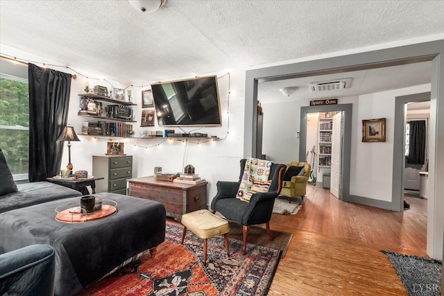 1920 Roxbury St, Lynchburg, VA 24501 - living area with wood finished floors and a textured ceiling