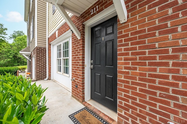 1810 Broadway St Unit 211, Lynchburg, VA 24501 - doorway to property with brick siding