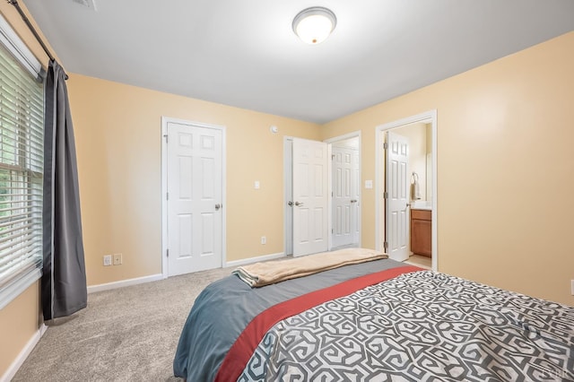 1810 Broadway St Unit 211, Lynchburg, VA 24501 - carpeted bedroom with baseboards and ensuite bath