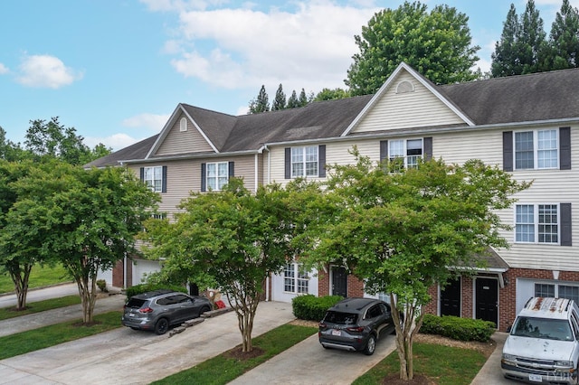 1810 Broadway St Unit 211, Lynchburg, VA 24501 - townhome / multi-family property featuring concrete driveway and brick siding