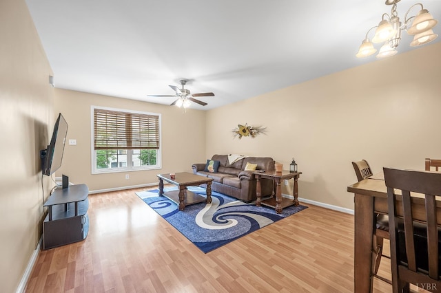 1810 Broadway St Unit 211, Lynchburg, VA 24501 - living area with wood finished floors, baseboards, a ceiling fan, and a chandelier
