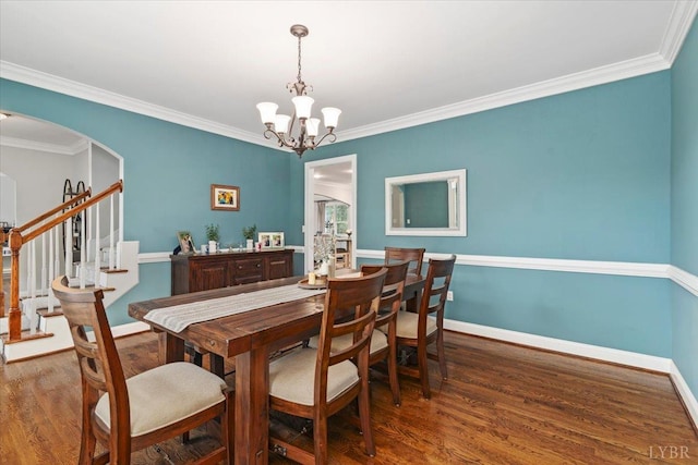 101 Trinity Ct, Lynchburg, VA 24502 - dining room featuring a chandelier, wood finished floors, arched walkways, baseboards, and ornamental molding