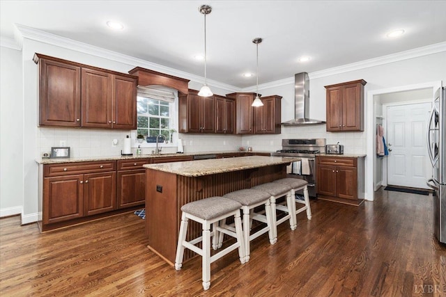 101 Trinity Ct, Lynchburg, VA 24502 - kitchen featuring wall chimney exhaust hood, appliances with stainless steel finishes, a kitchen island, dark wood-style floors, and crown molding
