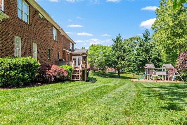 101 Trinity Ct, Lynchburg, VA 24502 - view of grassy yard featuring a playground, stairway, and a wooden deck