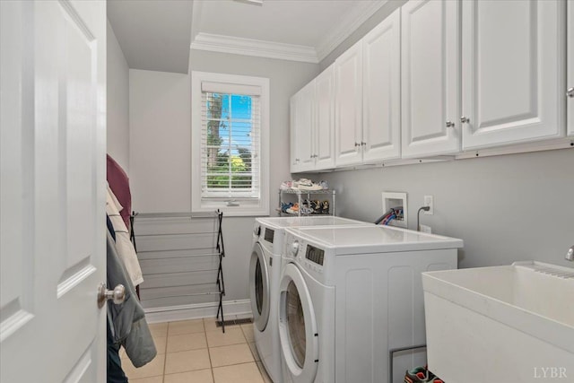 101 Trinity Ct, Lynchburg, VA 24502 - laundry area featuring washer and dryer, cabinet space, crown molding, light tile patterned flooring, and baseboards