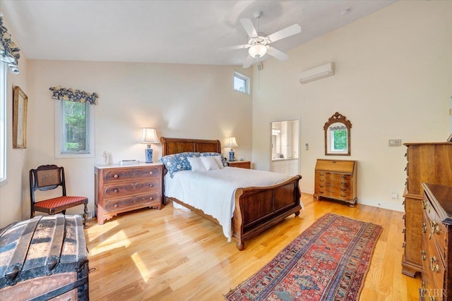 806 Cedar Key Ln, Huddleston, VA 24104 - bedroom with multiple windows, light wood-style flooring, ceiling fan, a wall unit AC, and high vaulted ceiling