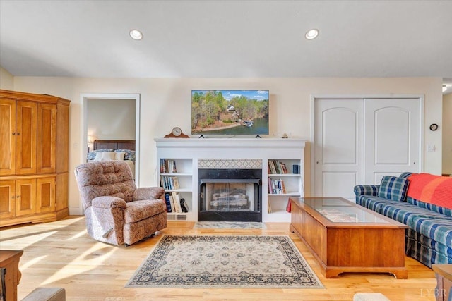 806 Cedar Key Ln, Huddleston, VA 24104 - living area featuring a tile fireplace, wood finished floors, and recessed lighting