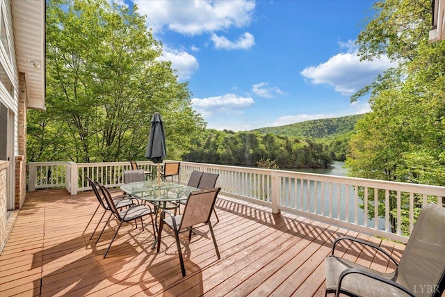 806 Cedar Key Ln, Huddleston, VA 24104 - wooden deck featuring a water view, a wooded view, and outdoor dining space