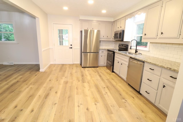 295 Charles Dr, Appomattox, VA 24522 - kitchen featuring stainless steel appliances, healthy amount of natural light, light stone countertops, and recessed lighting
