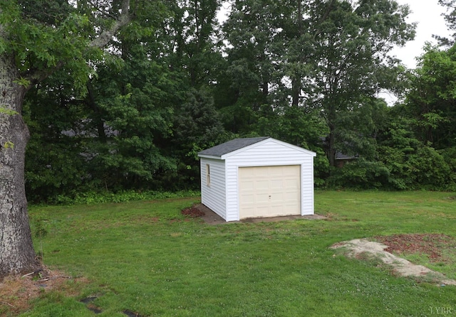 295 Charles Dr, Appomattox, VA 24522 - view of green lawn featuring an outbuilding and a detached garage
