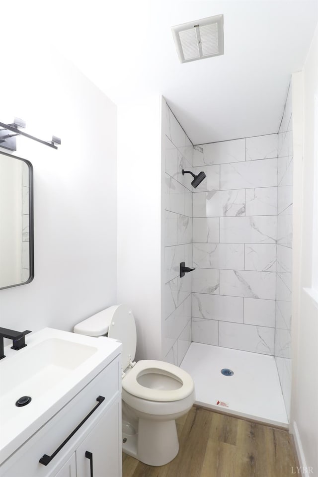 295 Charles Dr, Appomattox, VA 24522 - full bath featuring vanity, wood finished floors, and a tile shower