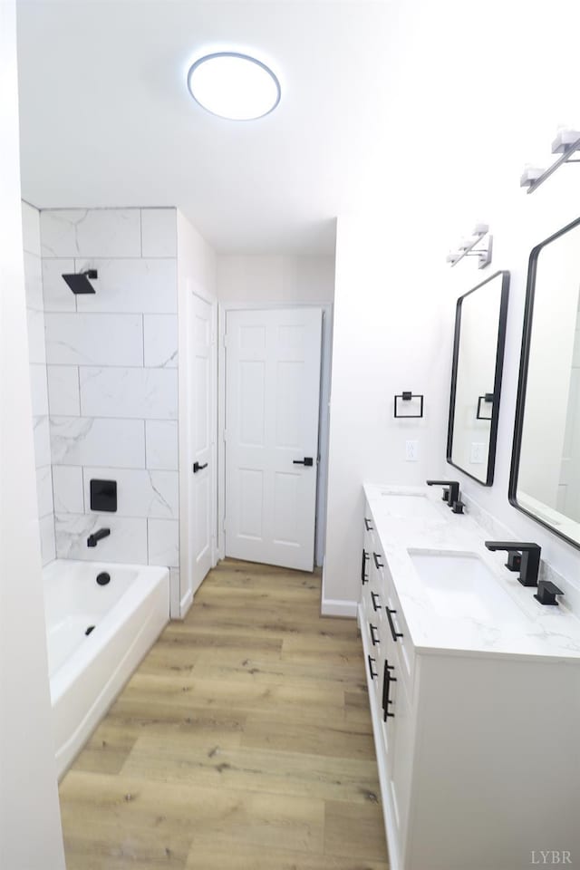 295 Charles Dr, Appomattox, VA 24522 - full bathroom with double vanity, wood finished floors, and shower / washtub combination