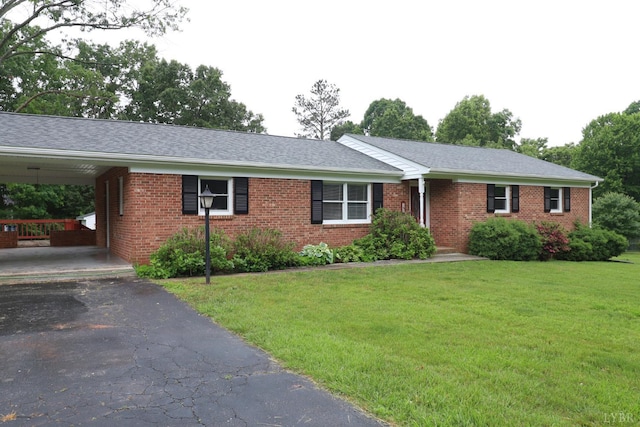 295 Charles Dr, Appomattox, VA 24522 - single story home with brick siding, a front yard, asphalt driveway, and a shingled roof