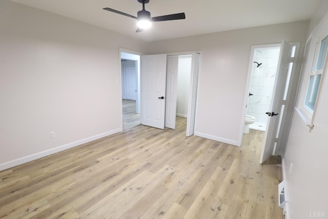 295 Charles Dr, Appomattox, VA 24522 - unfurnished bedroom with light wood-type flooring, ensuite bath, and a ceiling fan