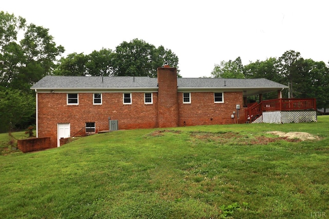 295 Charles Dr, Appomattox, VA 24522 - rear view of house featuring brick siding, a wooden deck, a chimney, a yard, and stairway