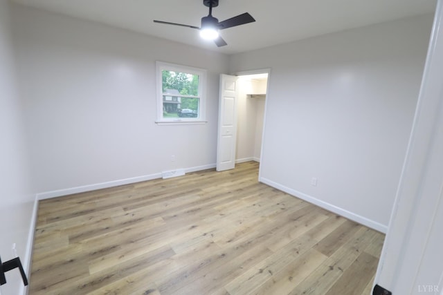 295 Charles Dr, Appomattox, VA 24522 - unfurnished bedroom featuring light wood-type flooring, ceiling fan, and a closet
