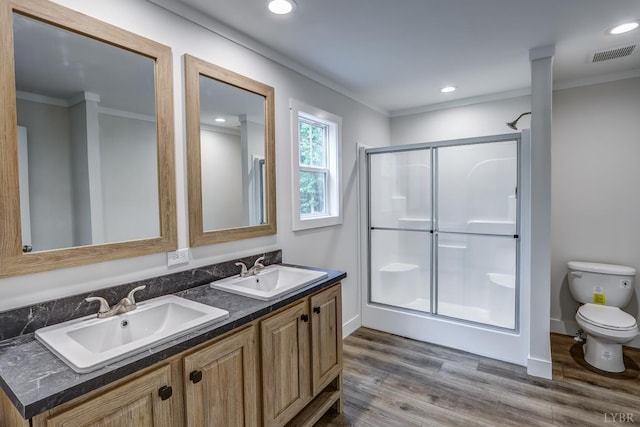 895 Union Hill Rd, Amherst, VA 24522 - bathroom with toilet, a stall shower, wood finished floors, double vanity, and ornamental molding