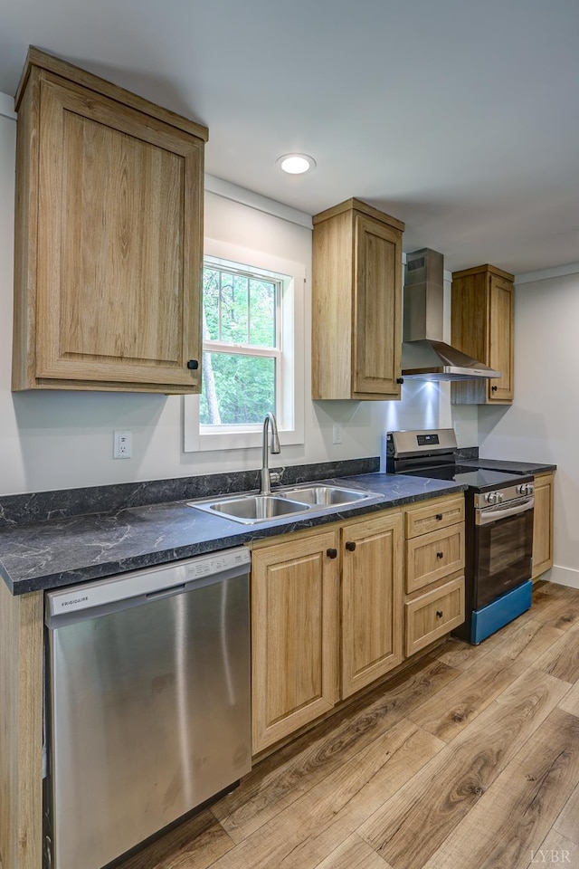 895 Union Hill Rd, Amherst, VA 24522 - kitchen featuring appliances with stainless steel finishes, wall chimney range hood, a sink, light wood-style floors, and recessed lighting