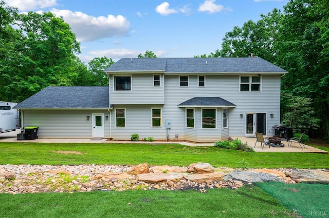 135 Warner Rd, Lynchburg, VA 24504 - back of house with an outdoor fire pit, a patio area, a lawn, and roof with shingles