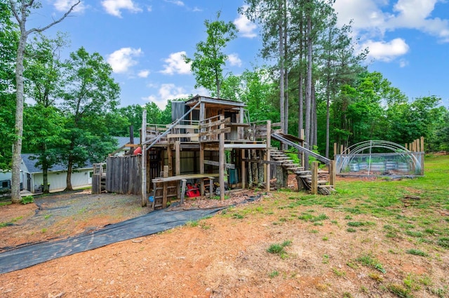 135 Warner Rd, Lynchburg, VA 24504 - rear view of house with view of wooded area
