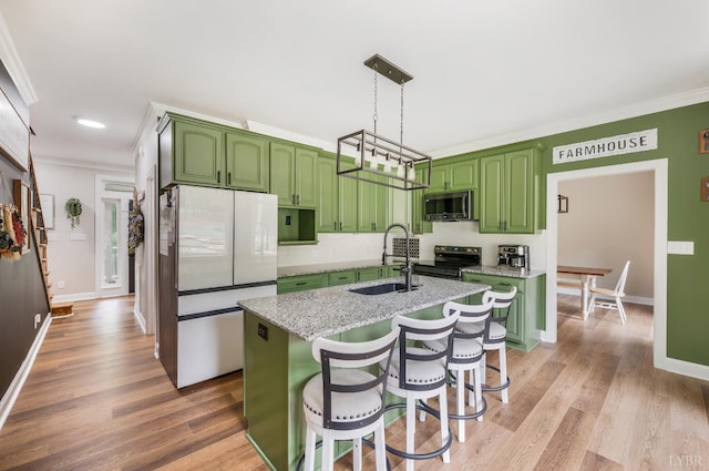 135 Warner Rd, Lynchburg, VA 24504 - kitchen with stainless steel appliances, a sink, ornamental molding, green cabinets, and light wood-type flooring