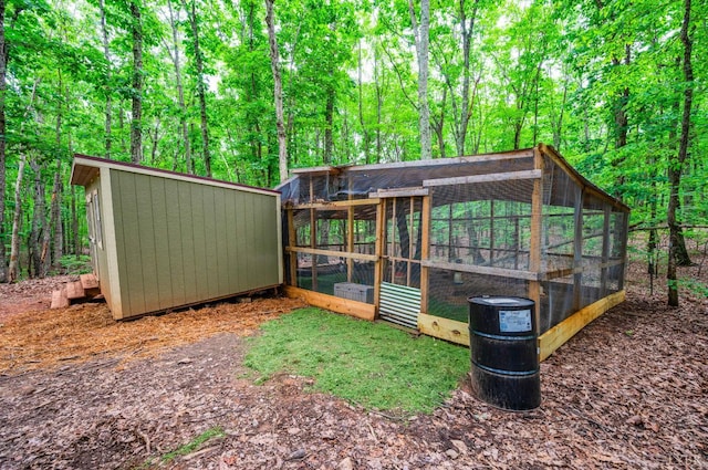 135 Warner Rd, Lynchburg, VA 24504 - view of yard with exterior structure, an outbuilding, and a wooded view