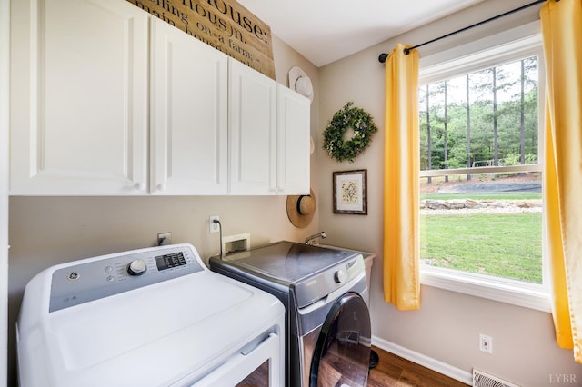 135 Warner Rd, Lynchburg, VA 24504 - laundry room featuring cabinet space, washing machine and dryer, wood finished floors, baseboards, and plenty of natural light