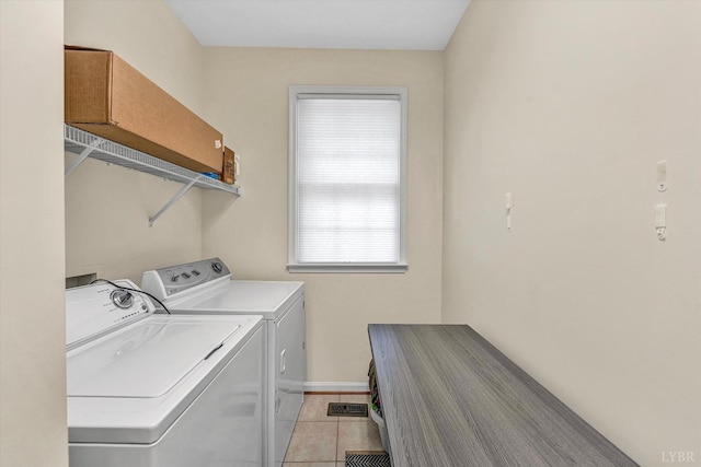1309 W Pine Ridge Rd, Huddleston, VA 24014 - laundry area featuring washer and clothes dryer, baseboards, and light tile patterned floors
