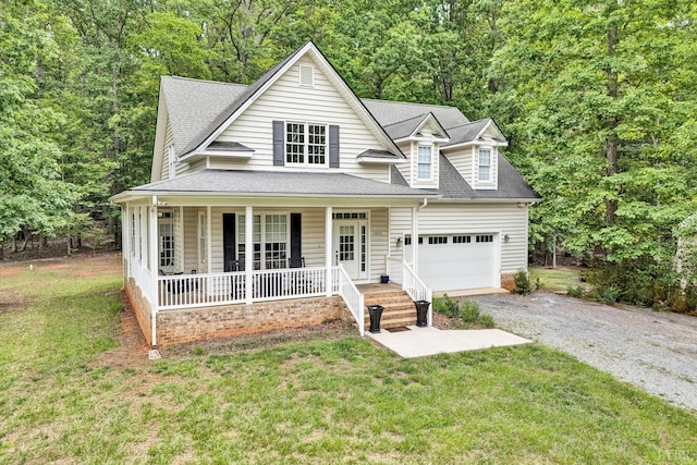 1309 W Pine Ridge Rd, Huddleston, VA 24014 - view of front of property featuring covered porch, a garage, driveway, and a front lawn