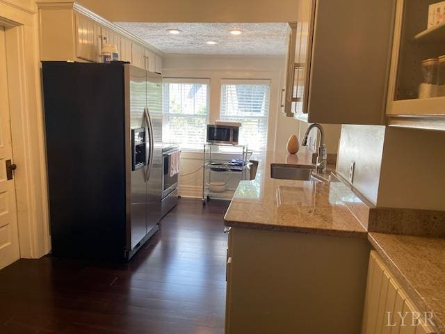 202 Leftwich St, Gretna, VA 24557 - kitchen featuring stainless steel appliances, a sink, dark wood-style floors, light stone countertops, and recessed lighting