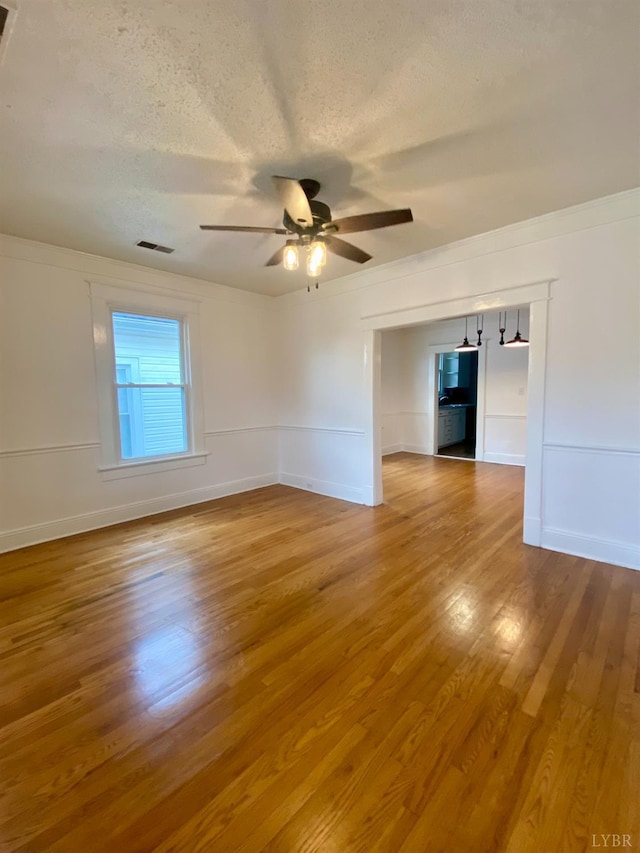 802 Erskine Ave, Lynchburg, VA 24501 - unfurnished room featuring a ceiling fan, wood finished floors, a textured ceiling, and baseboards