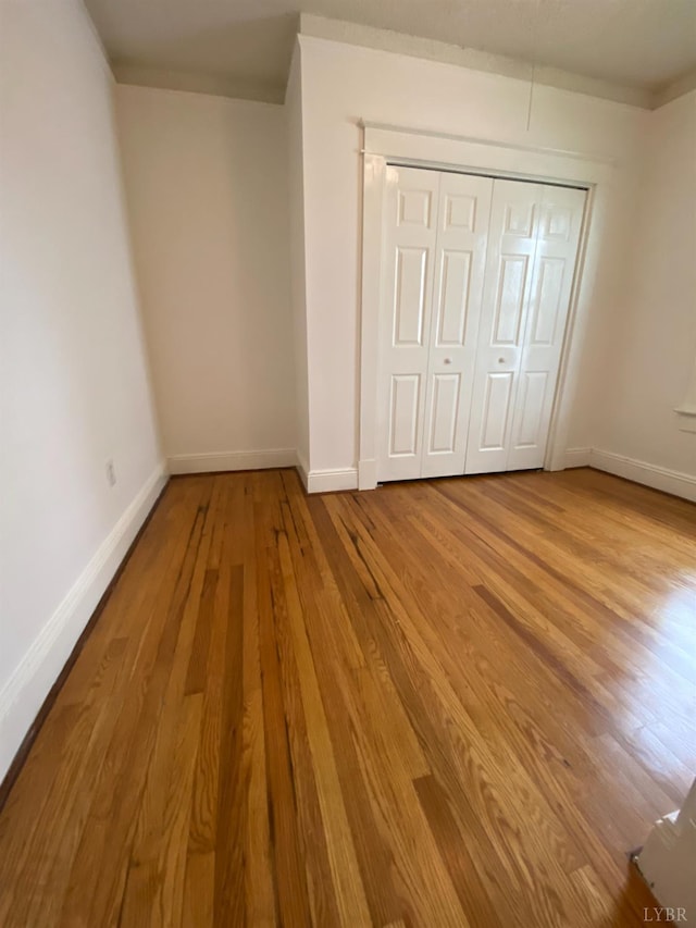 802 Erskine Ave, Lynchburg, VA 24501 - unfurnished bedroom featuring wood finished floors, baseboards, and a closet