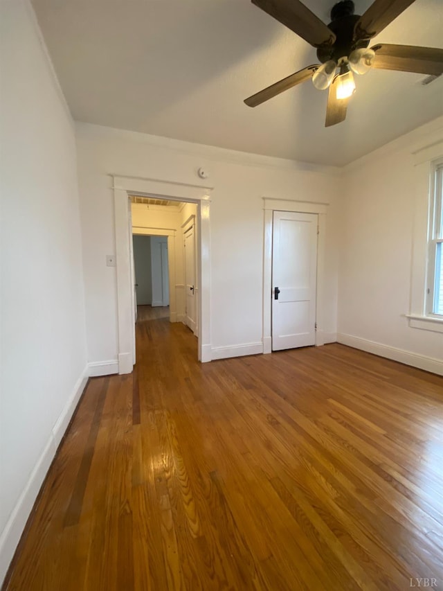 802 Erskine Ave, Lynchburg, VA 24501 - unfurnished bedroom featuring wood finished floors, baseboards, and ceiling fan