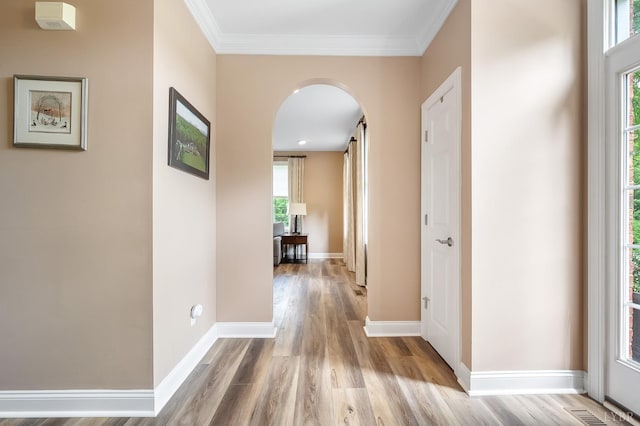 3374 Goode Station Rd, Goode, VA 24556 - hall featuring arched walkways, light wood-style floors, baseboards, and crown molding