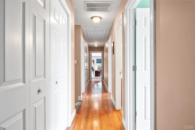 3374 Goode Station Rd, Goode, VA 24556 - hallway with attic access, light wood finished floors, and baseboards
