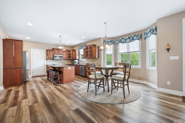 3374 Goode Station Rd, Goode, VA 24556 - dining space with baseboards, wood finished floors, and recessed lighting