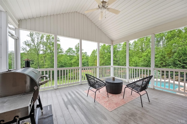 3374 Goode Station Rd, Goode, VA 24556 - sunroom / solarium with vaulted ceiling, ceiling fan, view of scattered trees, and plenty of natural light