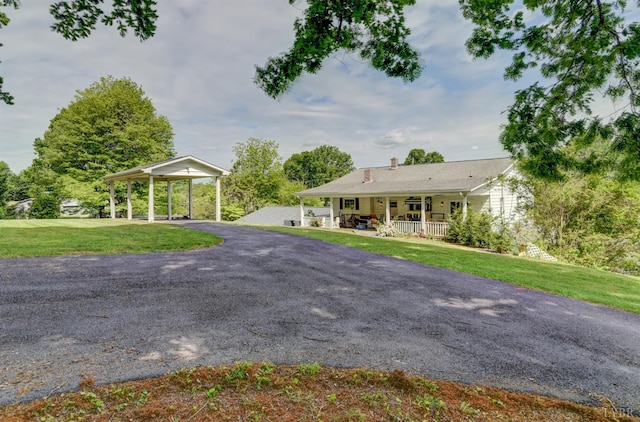 2770 W Lynchburg Salem Tpke, Bedford, VA 24523 - ranch-style home featuring a front lawn, a porch, a chimney, and driveway