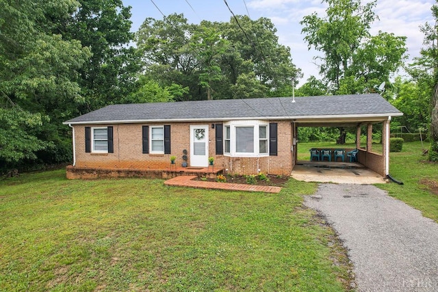702 11th St, Altavista, VA 24517 - single story home with brick siding, driveway, a front lawn, and a carport