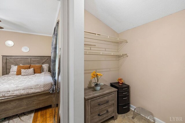 702 11th St, Altavista, VA 24517 - bedroom with vaulted ceiling, baseboards, and ornamental molding