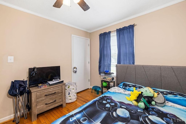 702 11th St, Altavista, VA 24517 - bedroom featuring wood-type flooring, ornamental molding, and ceiling fan