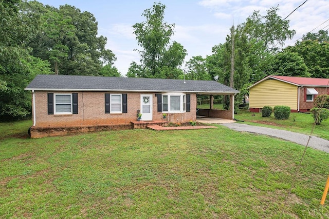 702 11th St, Altavista, VA 24517 - ranch-style house with asphalt driveway, brick siding, an attached carport, and a front lawn