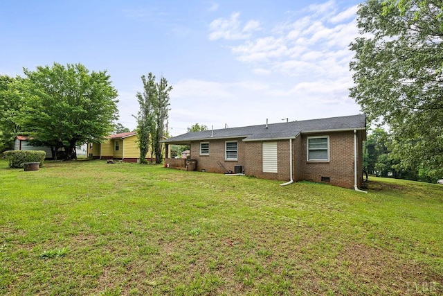702 11th St, Altavista, VA 24517 - back of house with brick siding, a yard, central AC unit, and crawl space