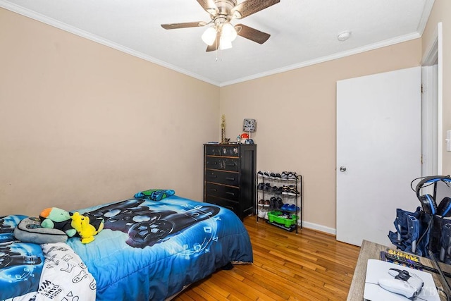 702 11th St, Altavista, VA 24517 - bedroom featuring light wood finished floors, ornamental molding, baseboards, and ceiling fan