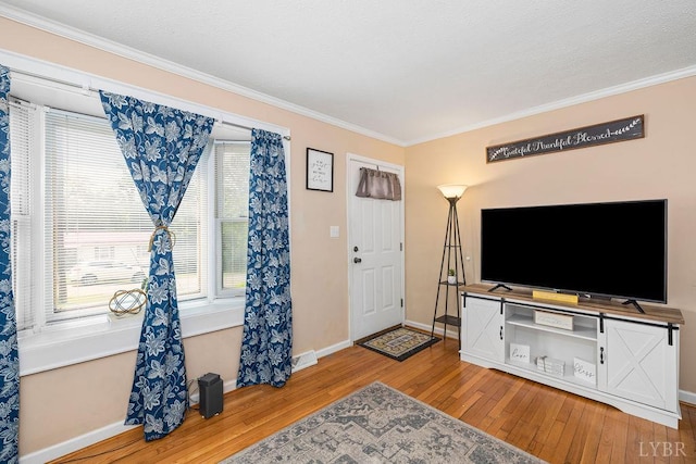 702 11th St, Altavista, VA 24517 - living area with hardwood / wood-style floors, ornamental molding, and baseboards