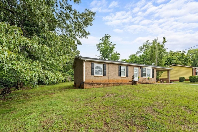 702 11th St, Altavista, VA 24517 - ranch-style house with brick siding and a front lawn