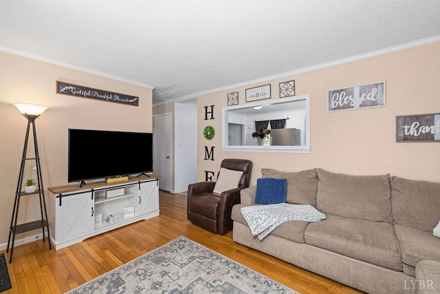 702 11th St, Altavista, VA 24517 - living area with light wood-style floors, ornamental molding, and baseboards