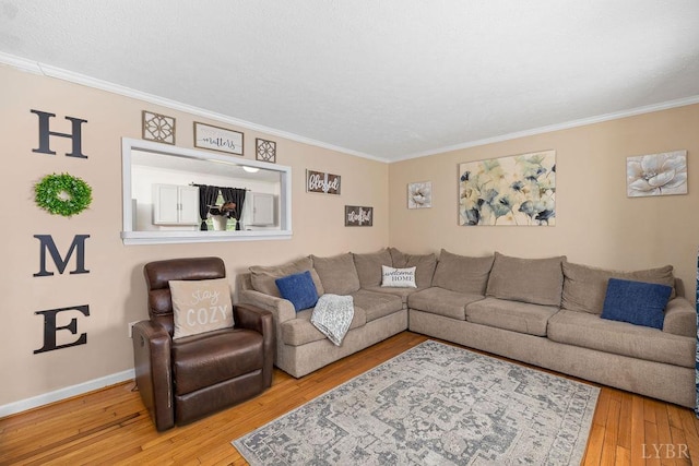 702 11th St, Altavista, VA 24517 - living area with ornamental molding, hardwood / wood-style floors, and baseboards