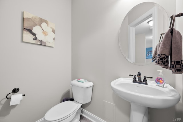 314 Cooper Way, Evington, VA 24550 - half bathroom with toilet, baseboards, and a sink
