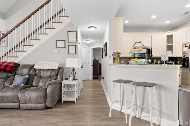 314 Cooper Way, Evington, VA 24550 - living area featuring wood finished floors, recessed lighting, stairway, and baseboards